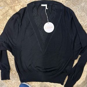 Chloe sweater in black, 70%, wool 30% silk. Lace detail